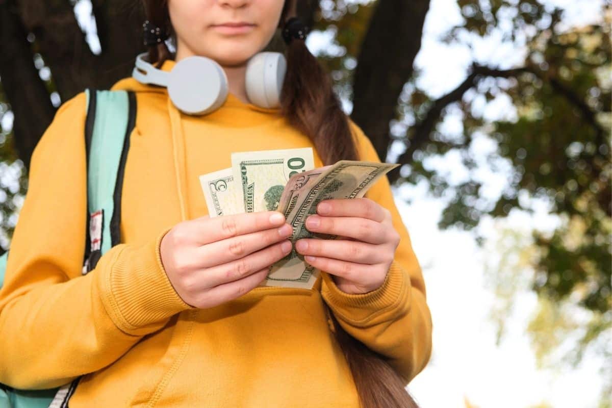 teenager counting cash