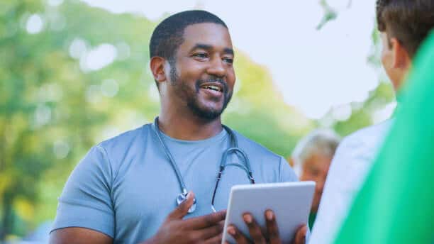 Doctor talks with community member during mobile health clinic