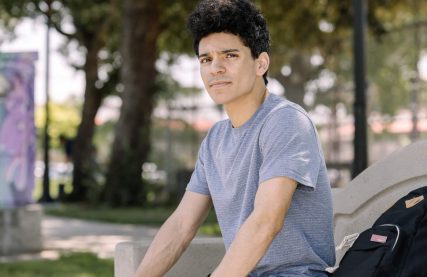 young man on bike facing systemic trauma in foster care